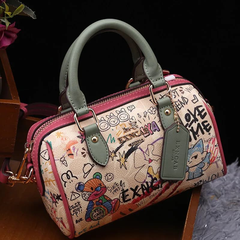 Sac Boston de luxe et vintage à porter à la main avec motifs graffiti de dessins animés tendance et 