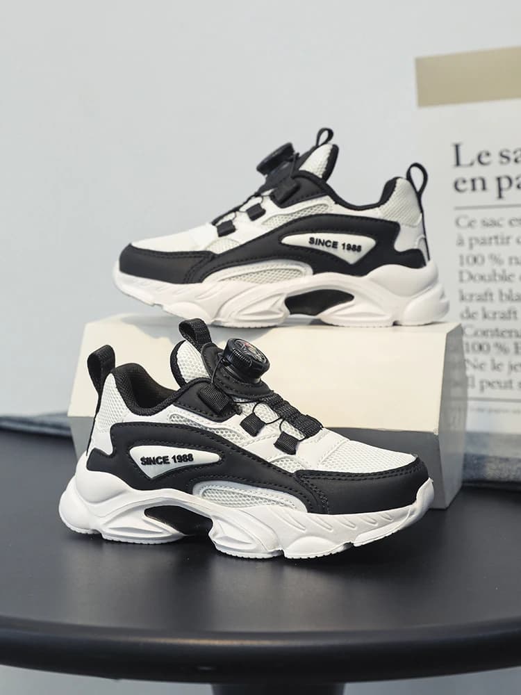 Boucle rotative à enfiler! Chaussures de sport noires en mesh pour enfants, respirantes et anti-chau