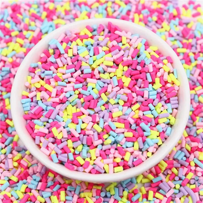 Mélange coloré de tranches d'argile polymère cylindrique, saupoudrage pour l'argile de remplissage d