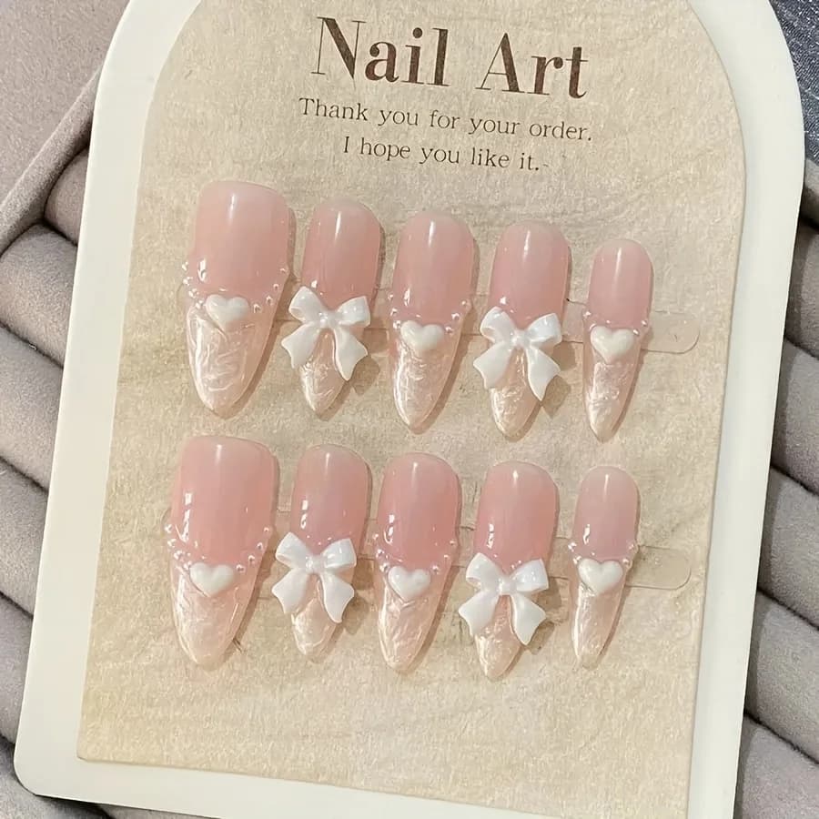 Faux ongles français haut de gamme en forme de cœur, nœud rose, faits à la main, patchs pour ongles 