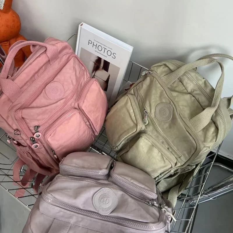 Sac à dos multi-poches pour femmes, sac à dos de voyage en Nylon de couleur unie à poignée souple, l