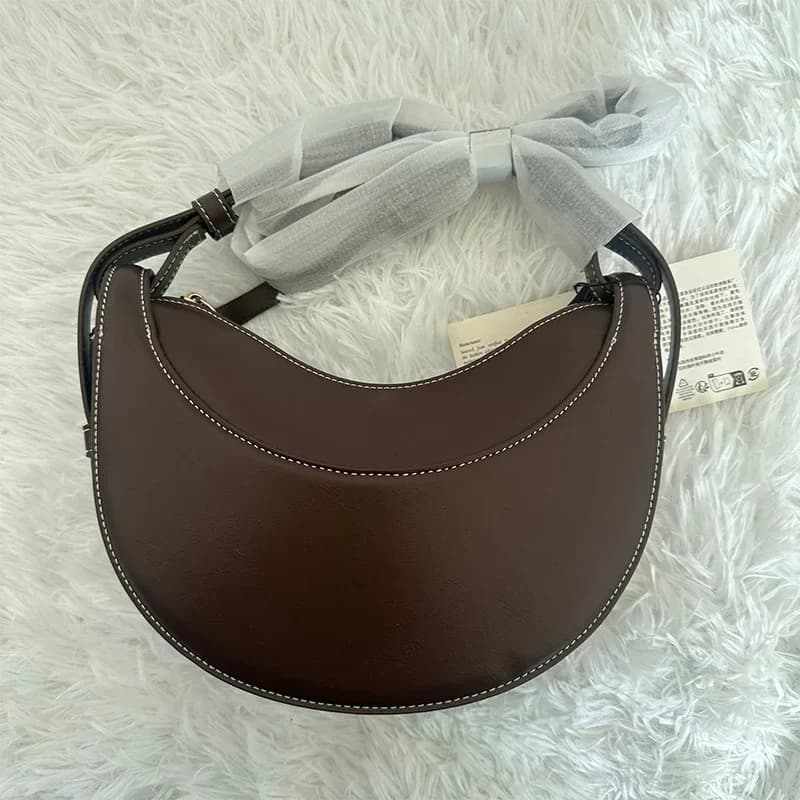 Sac à bandoulière pour femme en cuir véritable, style croissant, design original avec fermeture écla