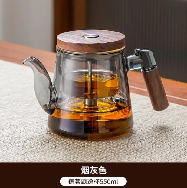 Le pot intérieur entièrement en verre de la théière est une tasse de séparation de thé-eau à bouton-