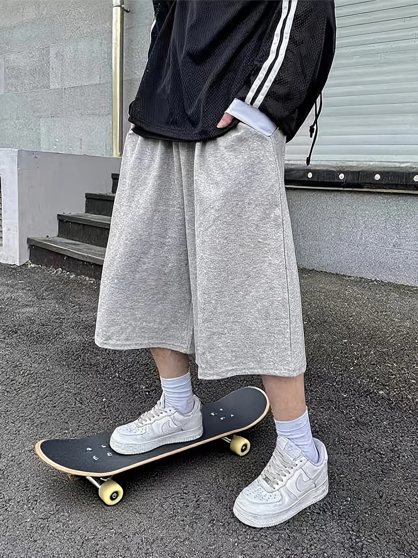 Pantalon unisexe ample style streetwear pour homme, longueur mi-cuisse, idéal pour le skateboard et 