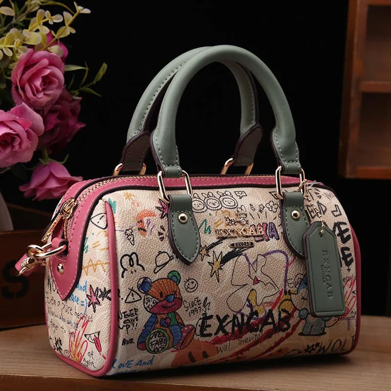 Sac Boston de luxe et vintage à porter à la main avec motifs graffiti de dessins animés tendance et 