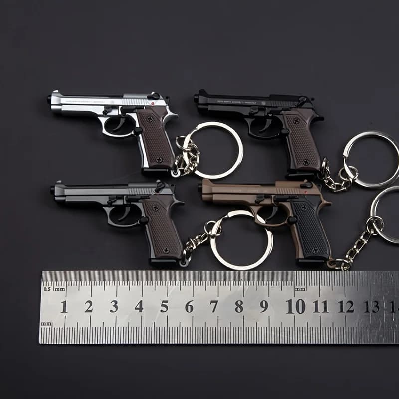 Porte-clés Pistolet Tactique 2025 - Modèle de Pistolet en Alliage 1:4 avec Pompons et Couvercle Tran