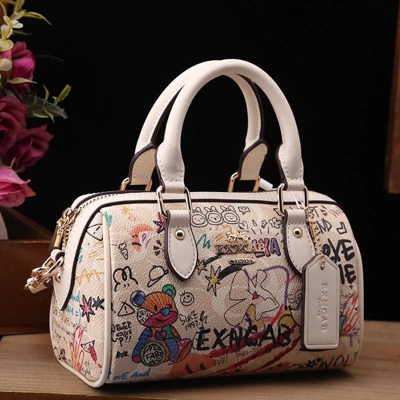 Sac Boston de luxe et vintage à porter à la main avec motifs graffiti de dessins animés tendance et 