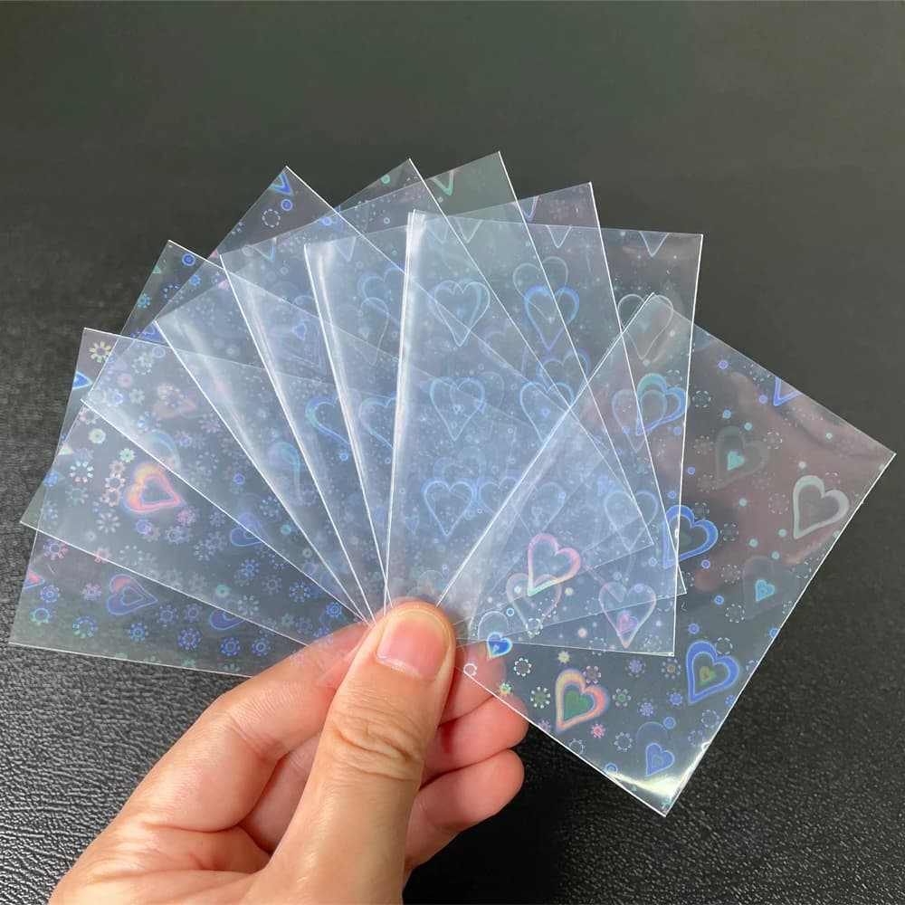 100 pcs/Lot feuille en forme de coeur Laser chargement par le haut TCG manchons de cartes YGO jeu de