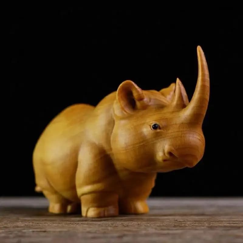 Figurines en bois sculptées représentant un trio africain : rhinocéros, hippopotame et éléphant, art