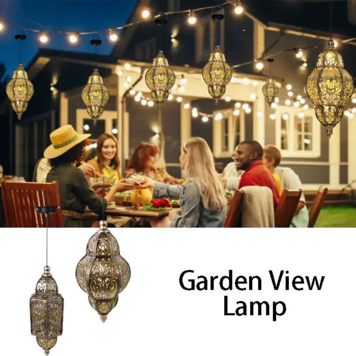 Lanterne solaire marocaine dorée avec fer forgé pour éclairage durable et ambiance chaleureuse occasions spéciales et soirées d'anniversaire
